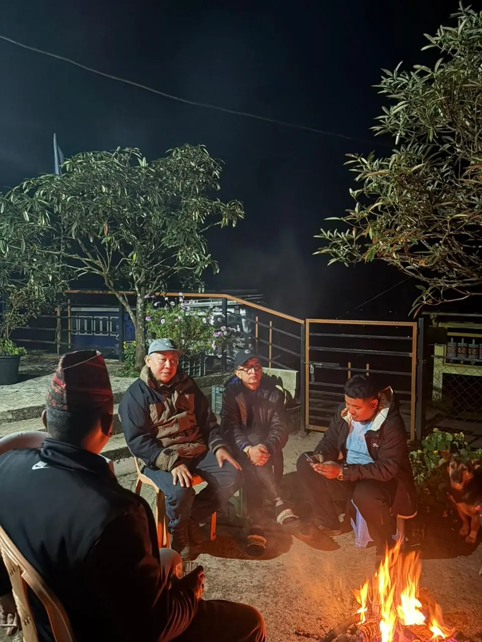 guests enjoying bonfire a Lali Gurash Homestay Okhrey Sikkim